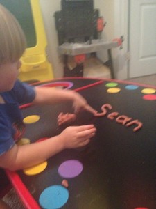Making letters out playdough